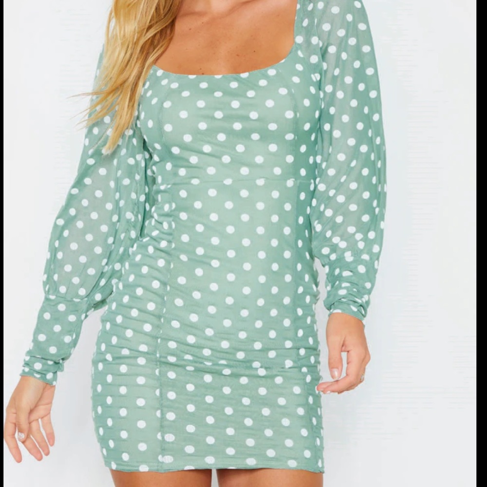 Mini long sleeved polka dotted dress